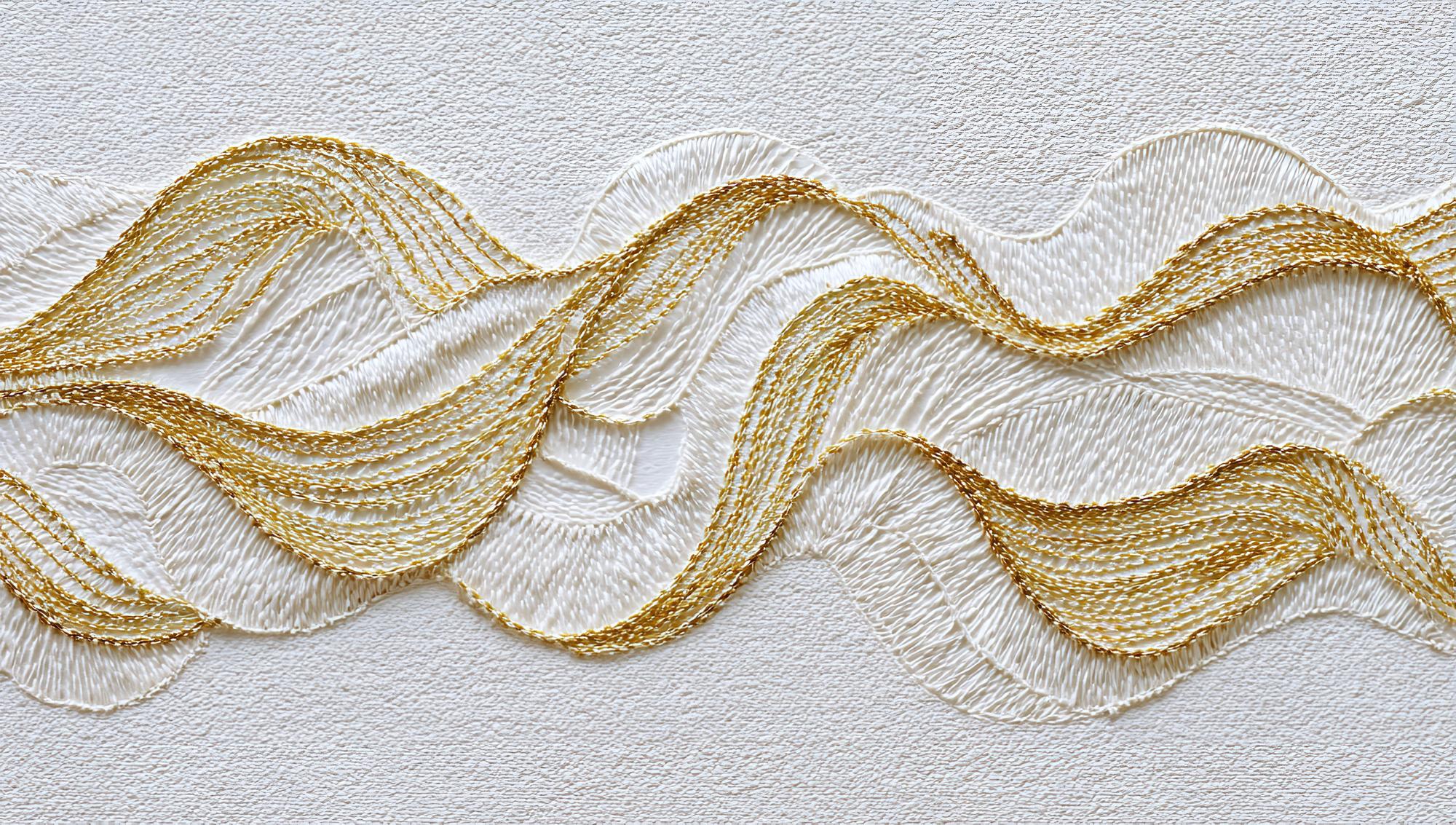 Close detail of gold thread embroidery