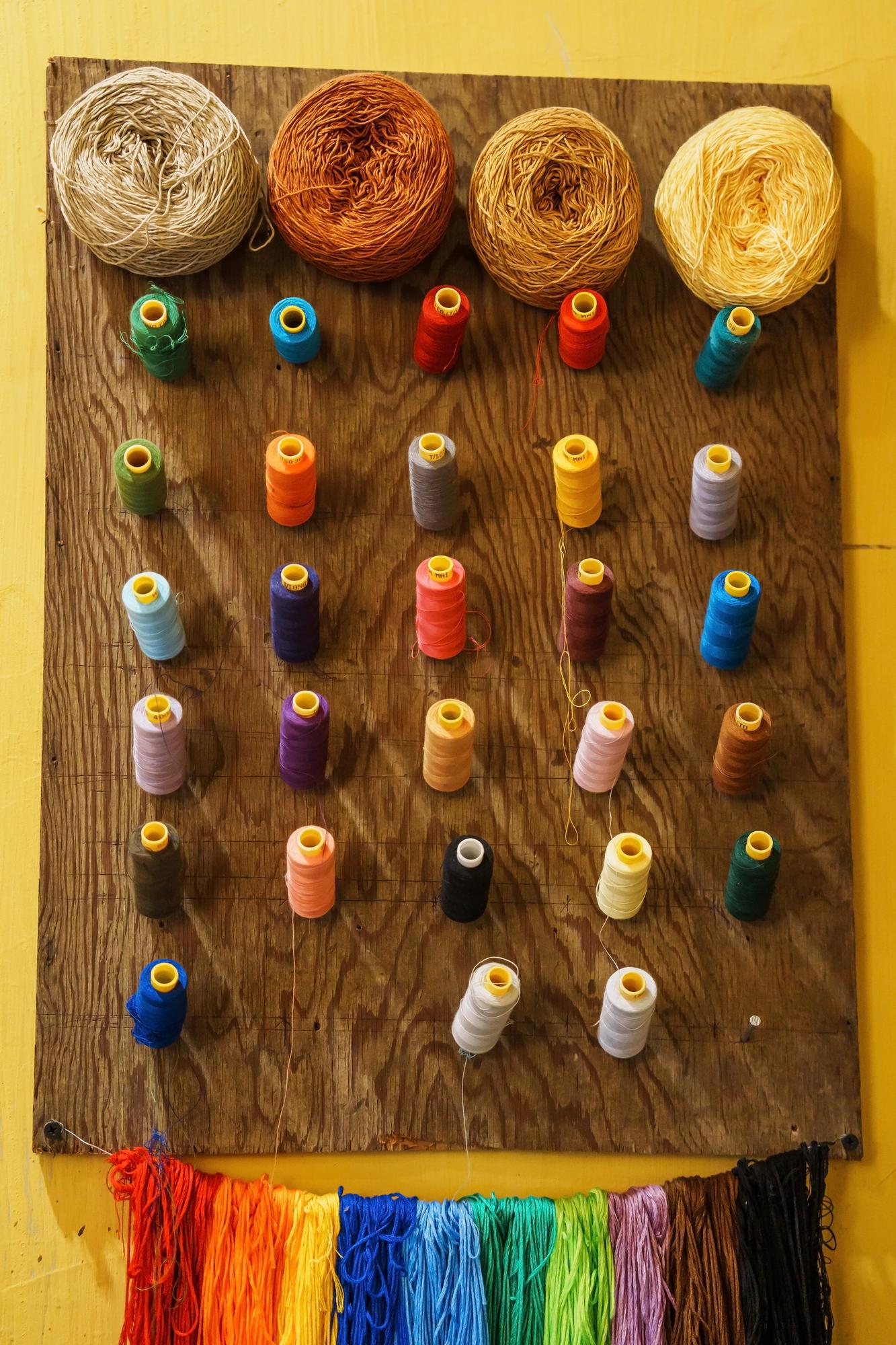 Collection of embroidered samples on board